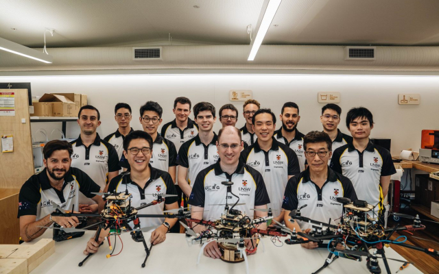 Dylan Sanusi-Goh (second from left) and Dr Mark Whitty (third from left) with the UNSW Engineering Competitive Robotics team