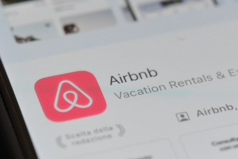 an airbnb logo download app page displayed on a smartphone