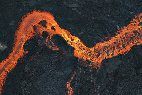 Aerial shot looking directly down on a river of lava, Iceland