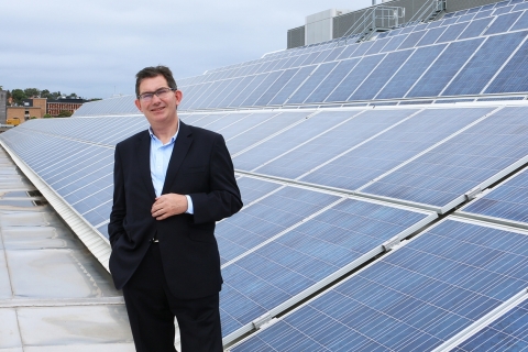 ian_jacobs_with_solar_pv_arrays_installed_across_rooftops_at_the_unsw_kensington_campus.jpg