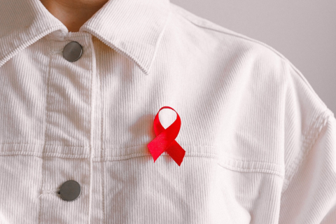 person wearing a red ribbon