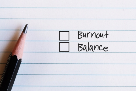 Notepad card with tick boxes for balance and burnout