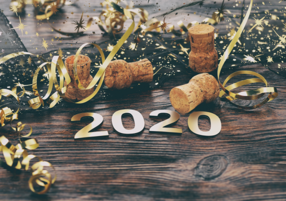 Celebrating the new year with 2020 on a wooden background.