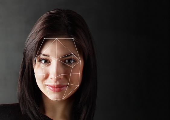 A closeup of a woman's face with data points highlighted