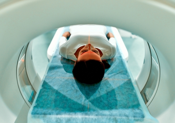 View from inside an MRI scanner of a young woman about to be scanned