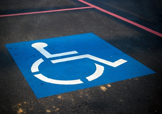 A disability symbol in a carpark space