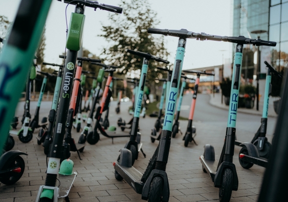 a group of e-scooters parked together