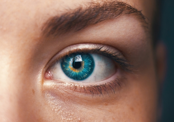 a close up of a woman's eyeball looking straight ahead