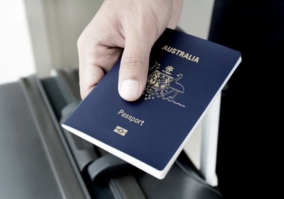 Hand holding an Australian passport