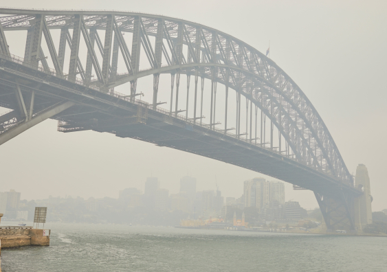 Sydney Harbour Bridge enveloped in smoke haze from bushfires in December 2019