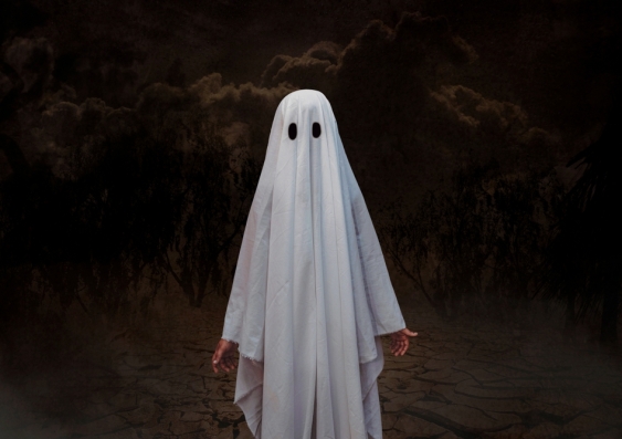 Person in a simple sheet ghost costume