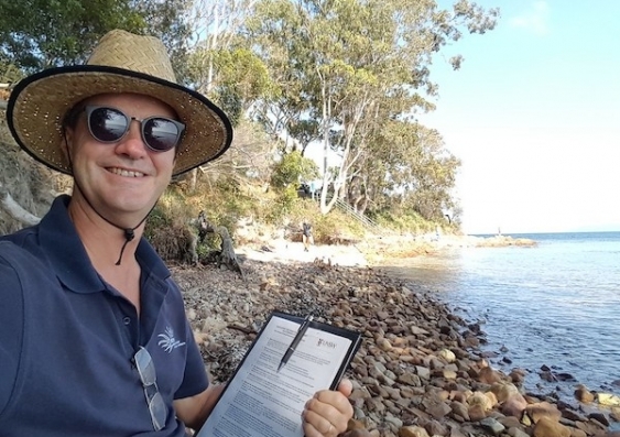 Researcher John Turnbull surveys Fly Point