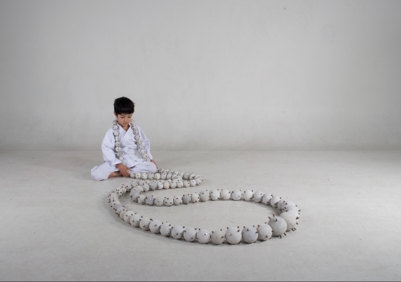 Child wearing Daijuzu (Large Prayer Beads) (2019), Guy Keulemans & Kyoko Hashimoto. Photo: Romon Yang