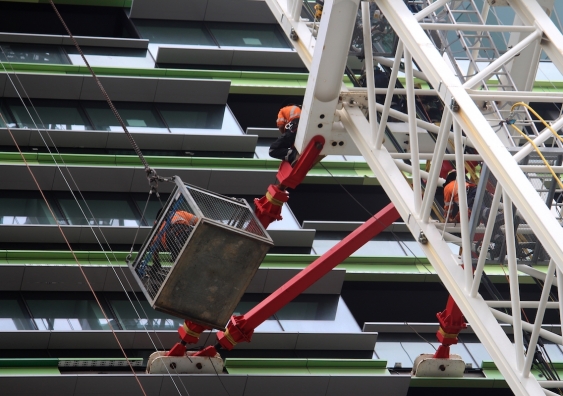 opal_tower_workers_on_a_crane_outside_the_building.jpg