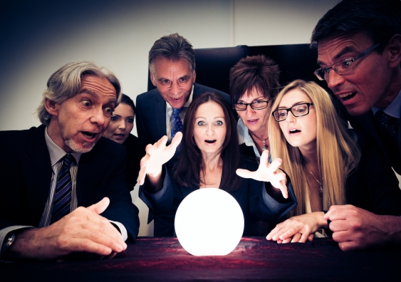people look in amazement at a crystal ball