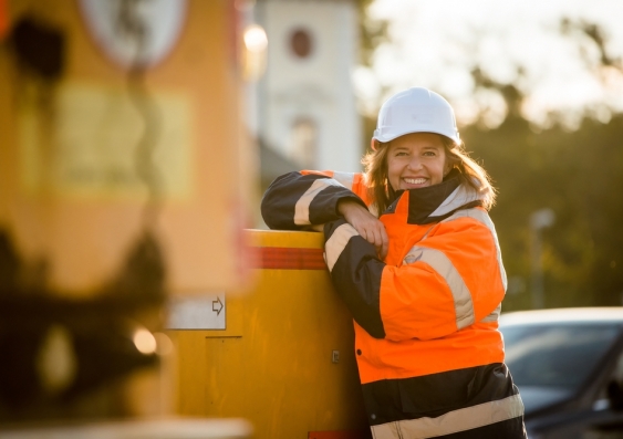Woman on construction site wearing high visibility jacket