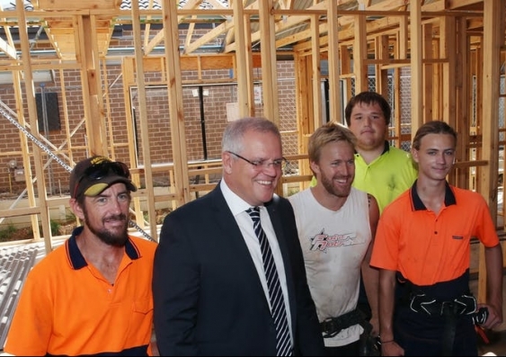 Scott Morrison and four construction workers smiling