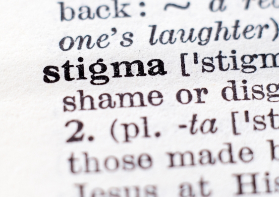 A close-up of the entry in a dictionary for the word stigma