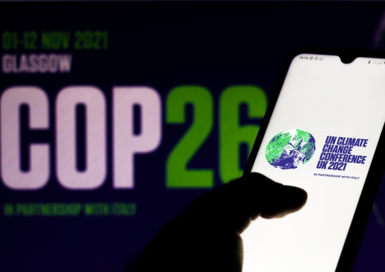In this photo illustration the 2021 United Nations Climate Change Conference (COP26) logo seen displayed on a smartphone
