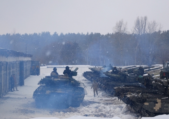 Russian soldiers in a tank on training grounds.