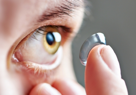 Person putting in a contact lens
