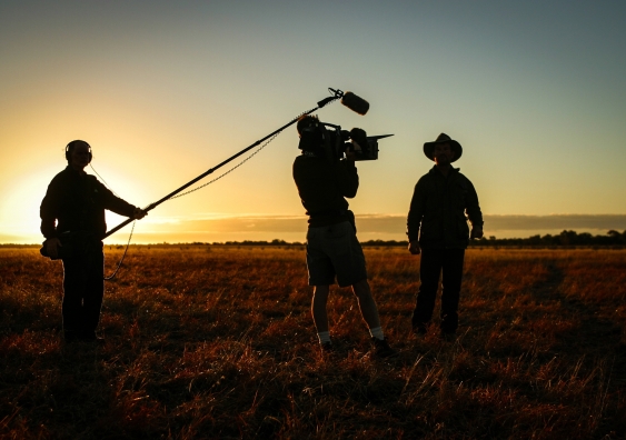 Film crew operating at sunset in Australia