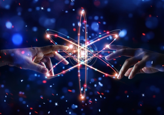 Artwork showing two hands about to touch behind a star shape of electron orbits