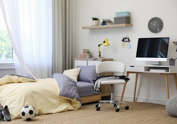 stylish teenagers room interior with comfortable bed and workplace