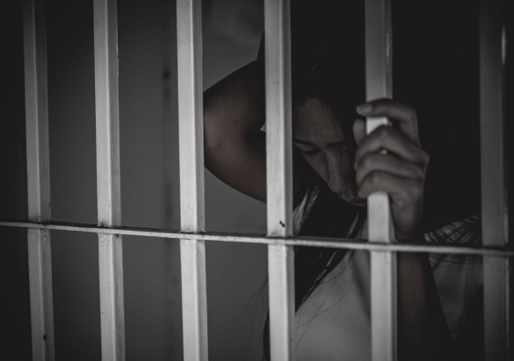 Woman behind bars