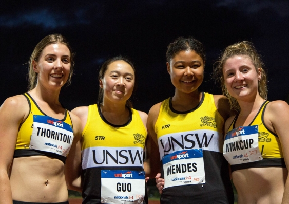 Group of women smiling in sports kit after competing 