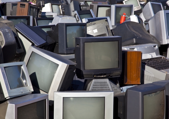 Unwanted analogue TVs piled up