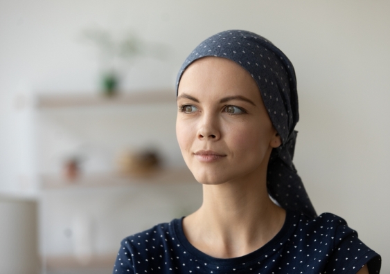 Woman who recently underwent cancer treatment wearing a headscarf
