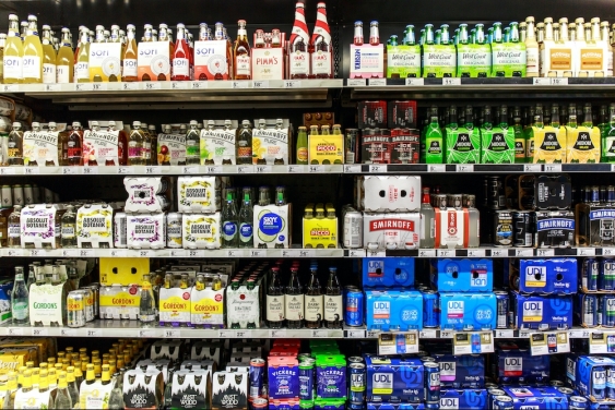 assortment of different pre-mix alcohol on a liquor store shelf