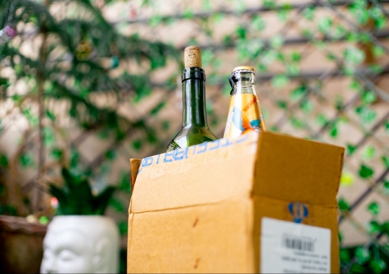 cardboard box with alcohol delivered at doorstep