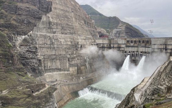 water_flows_through_a_giant_concrete_wall_next_to_a_cliff_face_in_sichuan.jpeg