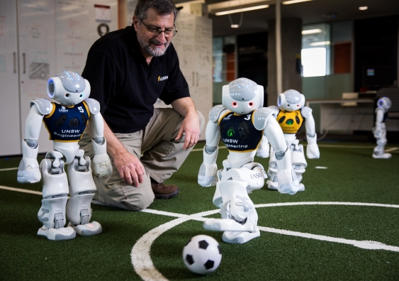 Professor Claude Sammut with some of the robots taking part in this year's tournament.