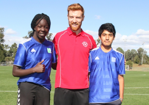 Founder of UNSW's Football United Dr Anne Bunde-Birouste (centre) with the team