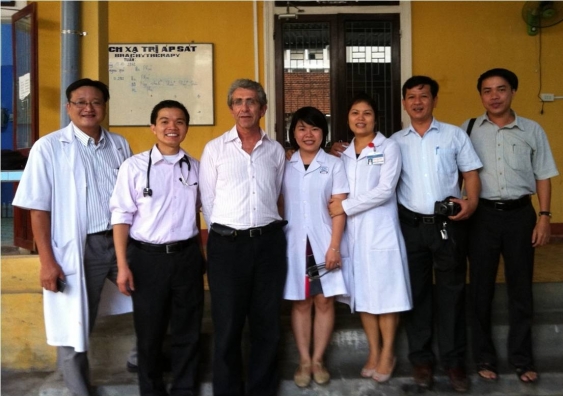 Professor David Goldstein (centre) and colleagues in Hue, Vietnam.