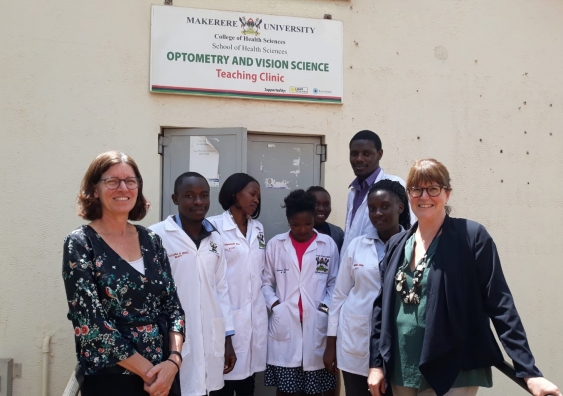 Dr Kathleen Watt and Associate Professor Isabelle Jalbert with students at the Makerere University Optometry and Vision Science Teaching Clinic.