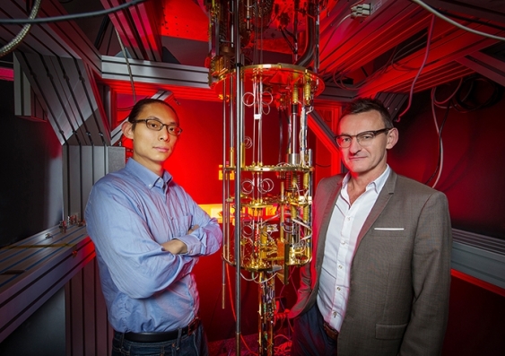 Dr Henry Yang and Professor Andrew Dzurak with a dilution refrigerator designed to keep qubits operating at extremely cold temperatures. Photo: UNSW Sydney