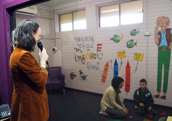 Dr Georgie Fleming stands behind a one-way mirror to coach a parent interacting with her child. Photo: UNSW