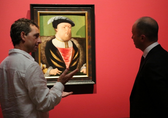 Simon Ives (left), paintings conservator at AGNSW, explains the finer details of the restoration to Matt Kean, NSW Minister for Innovation and Better Regulation. Photo: supplied
