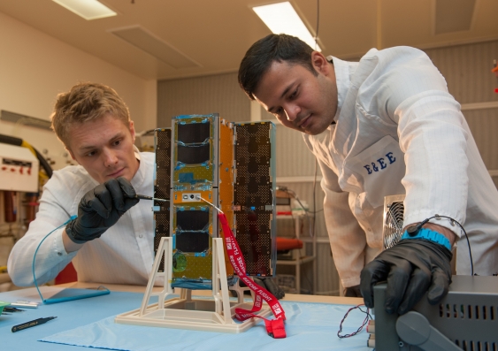 UNSW Canberra scientists working on a Cubesat. Photo: UNSW Canberra