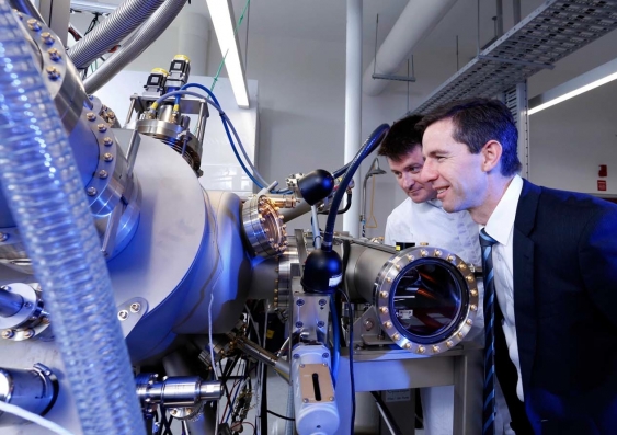 UNSW's Dr Stephen Bremner (left) showing  Education Minister Simon Birmingham one of the Molecular Beam Epitaxy (MBE) tools in the new laboratory. Photo: Grant Turner/Mediakoo