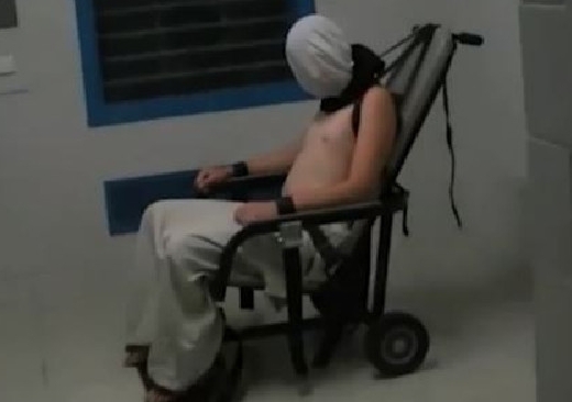 The now-infamous image of Dylan Voller hooded and shackled to a chair at the Don Dale youth detention centre in Darwin. Photo: ABC TV/4 Corners
