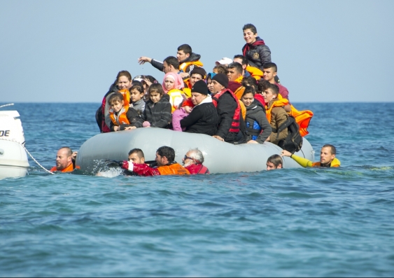 Refugees arriving in Greece in dinghy boat from Turkey in 2016. Photo: Shutterstock