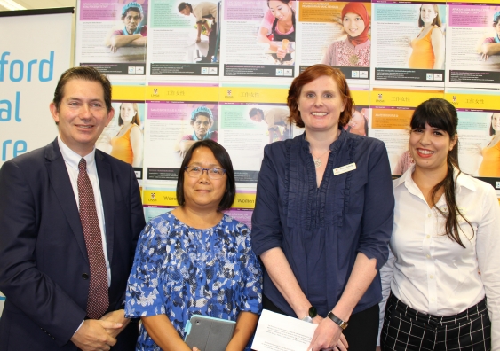 Vice-Chancellor Ian Jacobs, Asian Women at Work's Lina Cabaero, Emma Golledge and Maria Nawaz from the Kingsford Legal Centre
