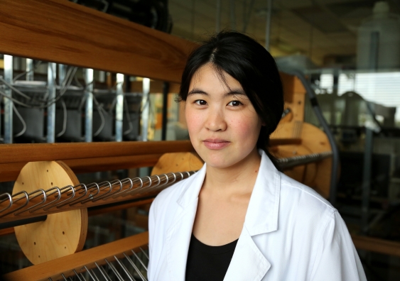 Joanna Ng with the weaver's loom. Photo: Leilah Schubert / UNSW Media
