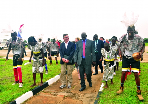 Gulu University Vice-Chancellor Professor Jack Pen-Mogi and the Bola Dancers welcome the UNSW delegation led by Professor Ian Jacobs at the Gulu Airfield.
