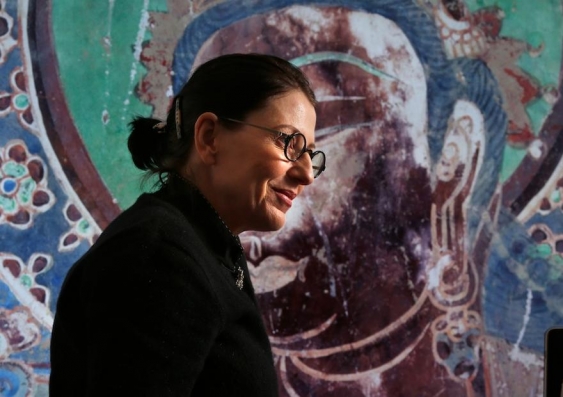 Preserving history - Professor Sarah Kenderdine with a high resolution detail from one of China's Dunhuang Caves. Photo: Quentin Jones